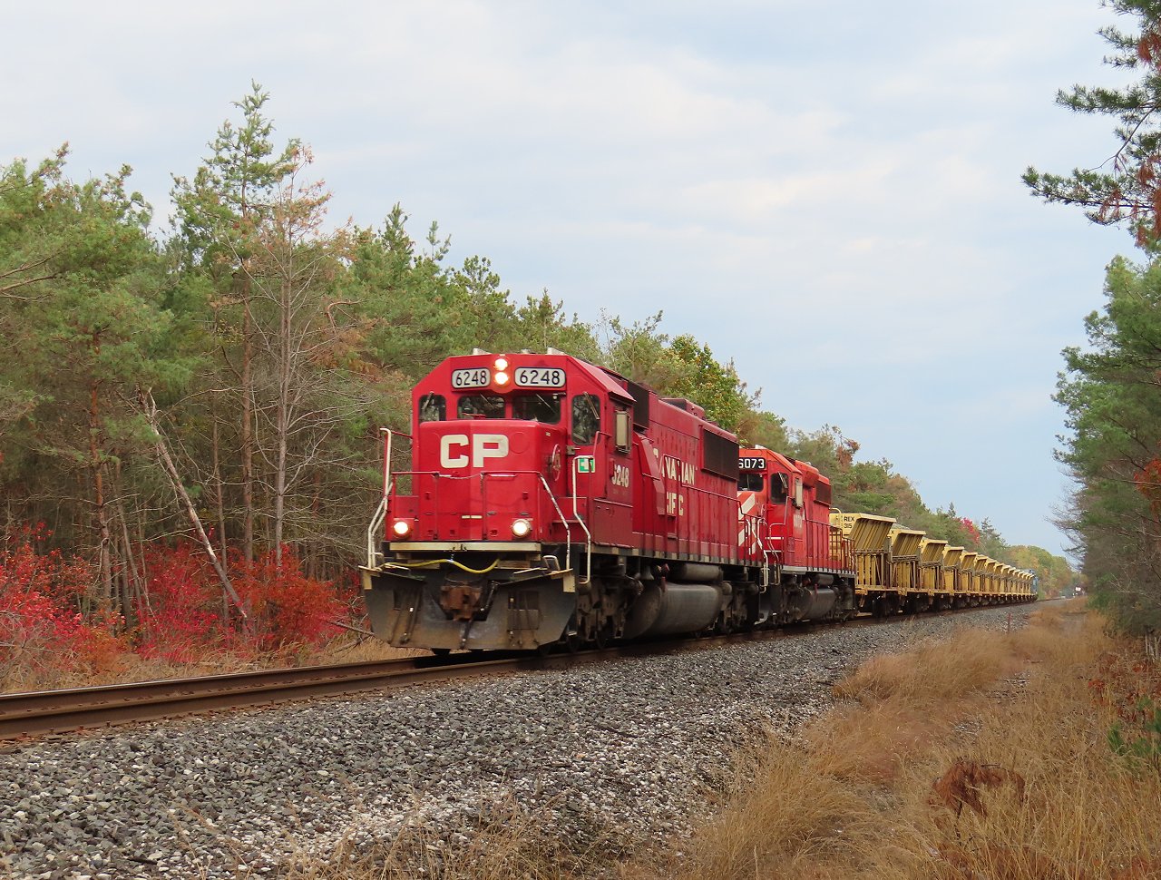 A loaded ballast train heads south towards Spence to unload.