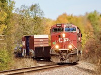 This has long been one of my favourite spots on the Hamilton Subdivision, especially in the autumn season. Unfortunately the colours this year are a bit weak. Nevertheless some decent angles can be found here along with the old telephone poles that add a bit to photos. Here a pair of AC4400 rebuilds dig into the curve before crossing Milburough Line. 