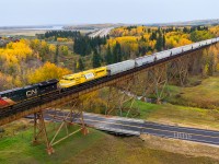 CN M 31151 30 soars over the Sturgeon River with CN 3055, EMDX 7206 and CN 2963 mid train.  There are now four EMDX SD70ACe T-4 on loan to CN to add some variety through the fall season; EMDX 7206, EMDX 7218, EMDX 7219 and EMDX 7222. 