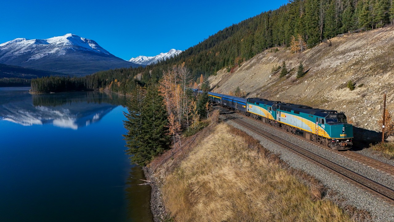 The eastbound Canadian skirts the shore of Yellowhead Lake, on a beautiful fall morning.