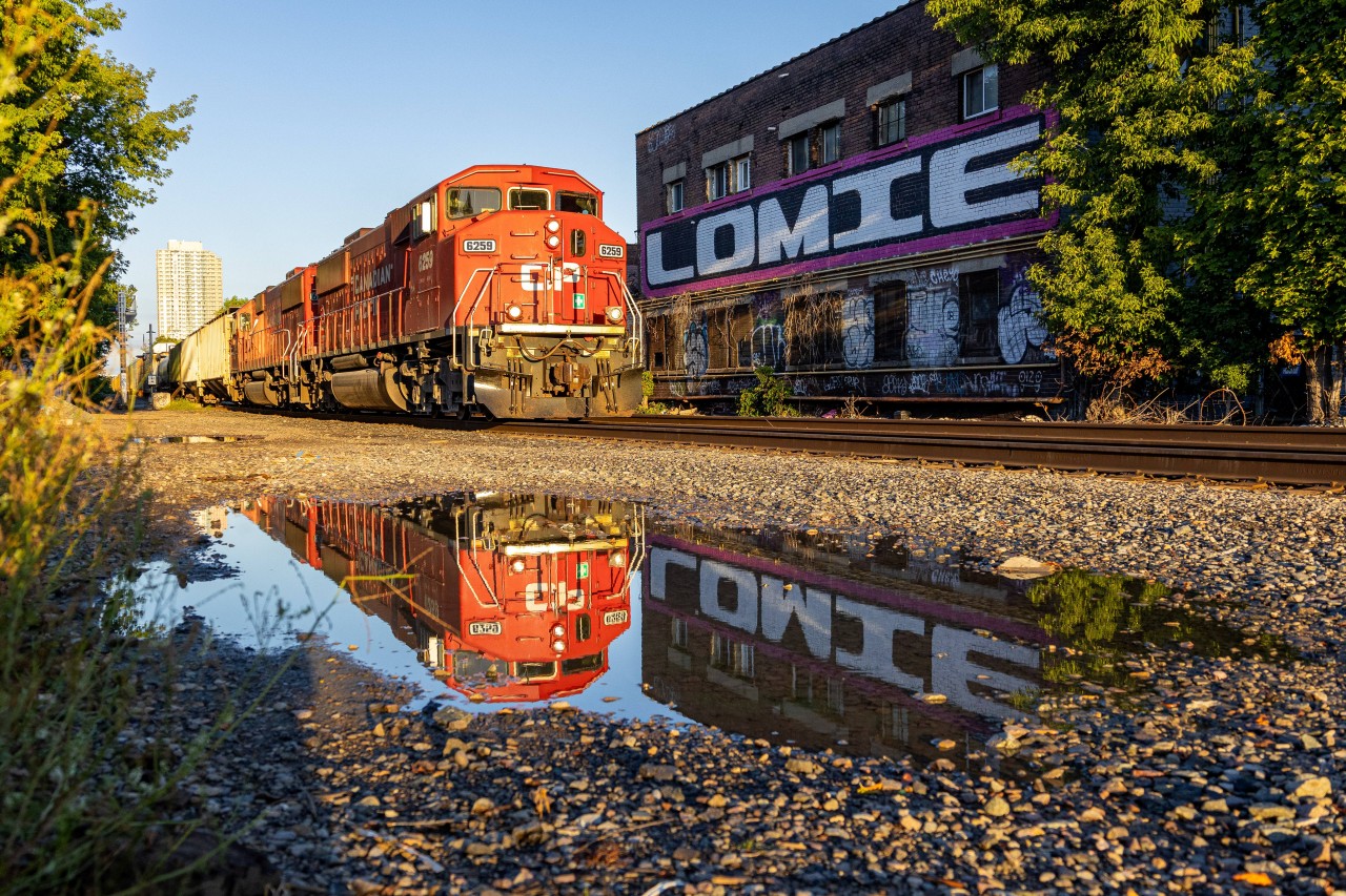 Old Toronto


With alarms set in the early morning hours to see if H17 will be daylight in Toronto, I get a call from a friend saying that they are lined down the Mactier sub, about an hour before sunrise. Unfortunately, the train was already approaching Elder as I got on the subway to attempt a searchlight shot on the Belleville.

So, I went to the closest spot to not risk missing the train in the morning light, which was at Bartlett.

This was my first time back at Bartlett since the signals were cut over, and the scene definitely felt different. But the buildings beside the road still give the spot some photographic value, along with the puddle to make the shot even better.