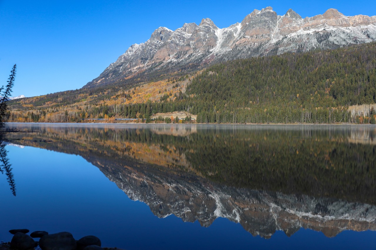 The eastbound Canadian rolls along the picturesque shore of Yellowhead Lake.