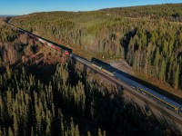 “A long forgotten, lonely cairn of stones” - Lyrics from Stan Rogers’ song “Northwest Passage” came to mind while awaiting the arrival of VIA’s Canadian at Dalehurst, Alberta.  You may recognize the name, as the location of the 1986 Hinton disaster, where the eastbound Super Continental, collided head-on with CN 413, on the single track just west of Dalehurst.  23 people died and 71 were injured in the incident, likely caused by medical distress and crew fatigue.  This led to major changes to the Canadian railway industry with new rest rules for trains crews and reset safety controls being mandated on locomotives.  39 years later, nature has reclaimed the derailment site, with no visible scars on the land; the only reminder is a small trackside monument, visible to the left of the conductor of CN G 87541 12.  With no public access, a long forgotten, lonely cairn of stones is all that remains to commemorate the tragedy that occurred nearly two decades ago in the foothills of Alberta.   