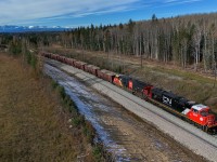 New power, newer track.  Brand new CN 8344 is relegated to work train service, handling an 88 car Herzog ballast train from McAbee Pit on the Ashcroft Sub.  W 90451 15 is sitting on the “construction track” between Dalehurst and Pedley, part of the major double tracking project on the Edson Sub, which will see double track extended between Hargwen and Galloway and Dalehurst and Pedley.  This will alleviate the most serious capacity constraint in Western Canada, as trains work towards the Obed Summit.  Don’t believe me?  Go watch a 30,000 ton grain train grind up the mountain through Medicine Lodge at 0.45HPT on the single track! 