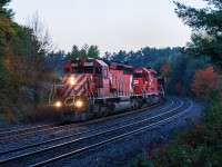 There isn't much better than Muskoka, Parry Sound for three days of foaming. Add in the fall colours, and I think it's the best you can get without mountains. Day three is still thinking about dawning as the third McDonald's hash brown goes down, and CN 111 threads the crossovers heading north. The scanner comes to life "6045 South, RTC". I'm not hearing that right, but there is light on the southbound CN tracks as 111 clears, and the scanner comes to life again..."6045 South cleared signal 19.3 Reynolds to north siding switch Mactier". All plans for the day are now altered. 

I cannot change the reality that I didn't spend a ton of time trackside during the 80s and 90s. But I'm not missing this. 

I have always thought the SD40 is the best-looking diesel locomotive ever made. Its wide cab version is my true favourite, but this is 1A. There is no sound better than a pair of GM 645's winding up with a diverging clear signal, and the beginning of a chase that will end in Bala. 