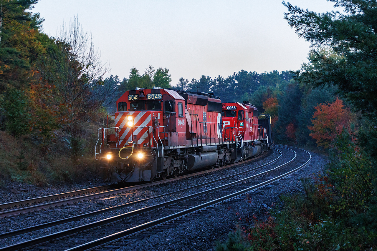 There isn't much better than Muskoka, Parry Sound for three days of foaming. Add in the fall colours, and I think it's the best you can get without mountains. Day three is still thinking about dawning as the third McDonald's hash brown goes down, and CN 111 threads the crossovers heading north. The scanner comes to life "6045 South, RTC". I'm not hearing that right, but there is light on the southbound CN tracks as 111 clears, and the scanner comes to life again..."6045 South cleared signal 19.3 Reynolds to north siding switch Mactier". All plans for the day are now altered. 

I cannot change the reality that I didn't spend a ton of time trackside during the 80s and 90s. But I'm not missing this. 

I have always thought the SD40 is the best-looking diesel locomotive ever made. Its wide cab version is my true favourite, but this is 1A. There is no sound better than a pair of GM 645's winding up with a diverging clear signal, and the beginning of a chase that will end in Bala.
