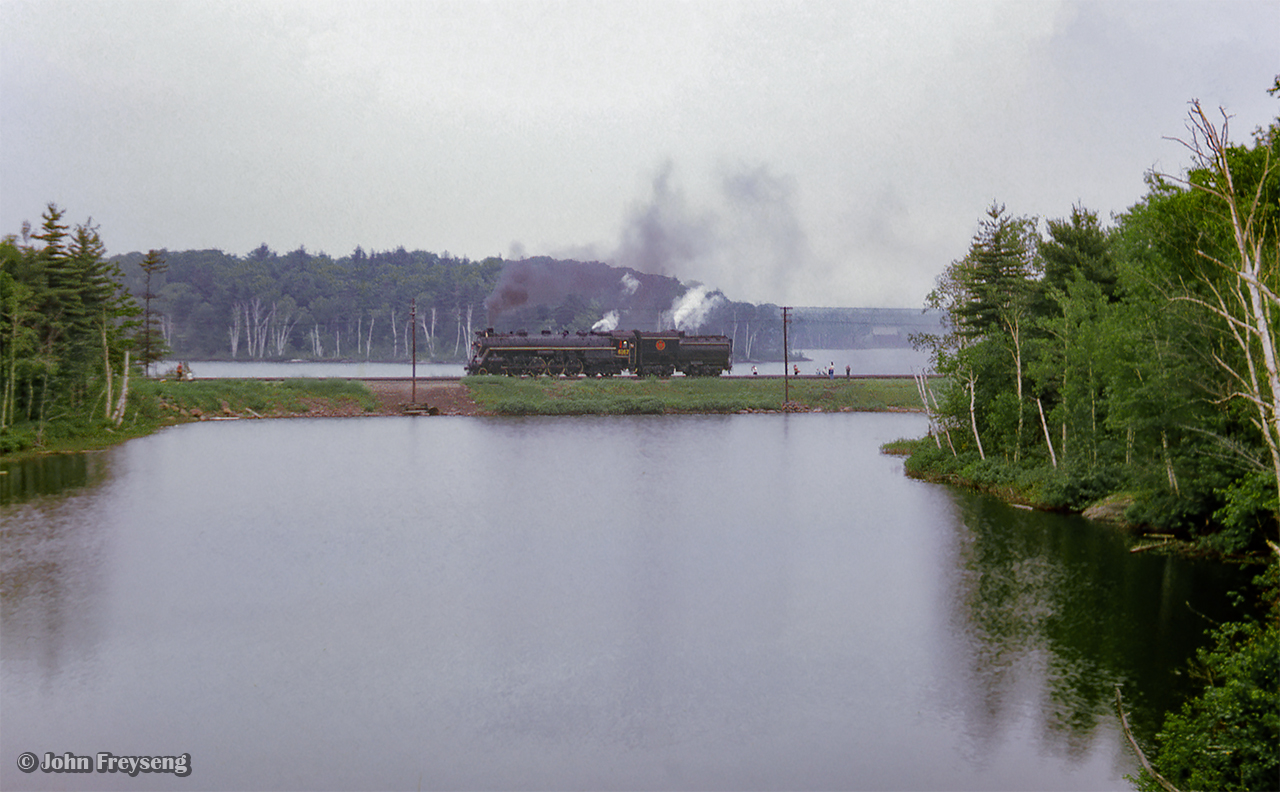 Just after the southbound Canadian passed, CNR 6167 is seen across the water at South Parry undergoing servicing before returning to Toronto.

Scan and editing by Jacob Patterson.