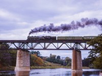 Running Windsor - Paris - Stratford, an excursion of the Michigan Railroad Club makes a runpast over the Grand River at Paris.

<br><br>A busy day:
<br><a href=https://www.railpictures.ca/?attachment_id=52960>Train 77 arriving Bayview</a>
<br><a href=https://www.railpictures.ca/?attachment_id=53821>Train 29 Bayview</a>
<br><a href=https://www.railpictures.ca/?attachment_id=54098>Extra freight eastbound</a>
<br><a href=https://www.railpictures.ca/?attachment_id=53125>Train 77 departing Bayview</a>
<br><a href=https://www.railpictures.ca/?attachment_id=51601>Intercity Limited at Paris</a>

<br><br><i>Scan and editing by Jacob Patterson.</i>
