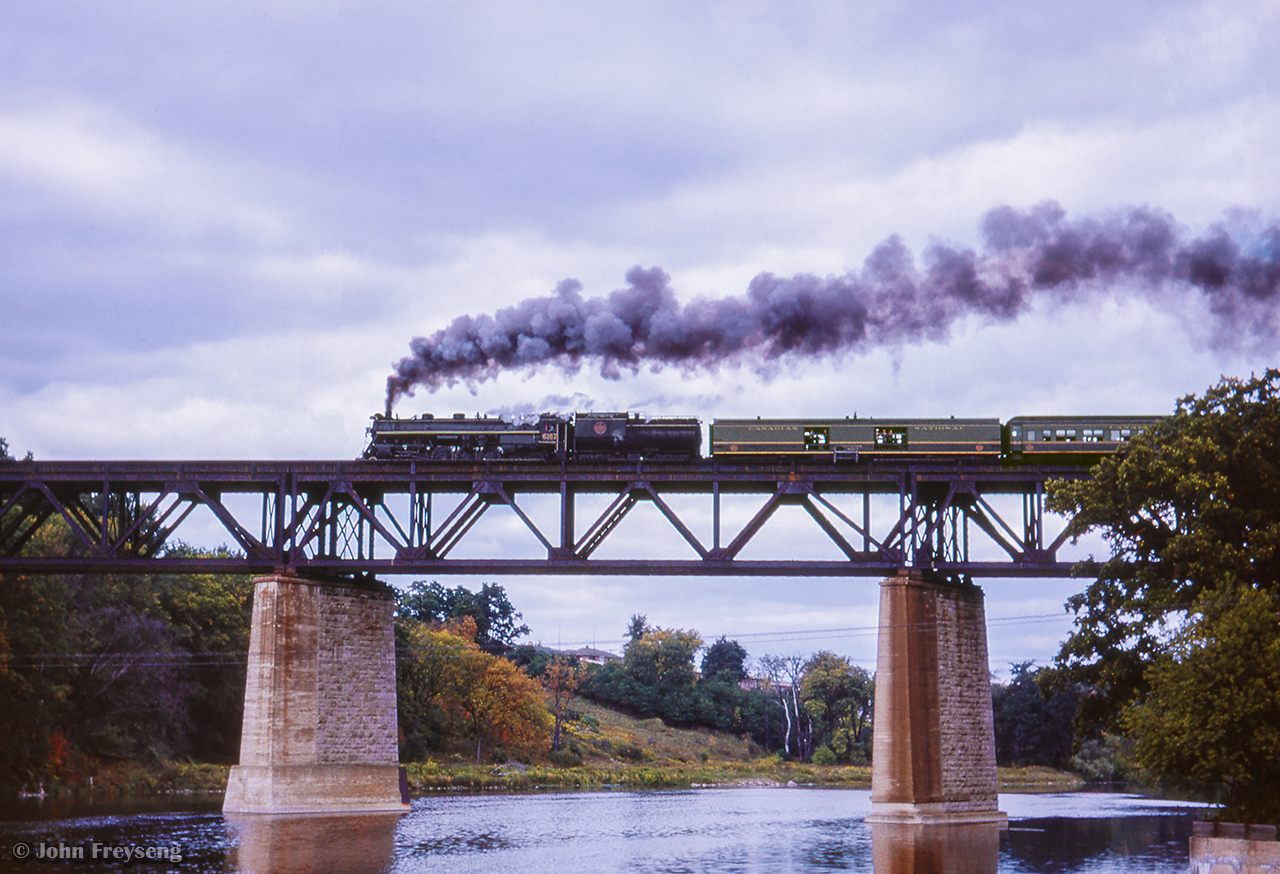 Running Windsor - Paris - Stratford, an excursion of the Michigan Railroad Club makes a runpast over the Grand River at Paris.

A busy day:
Train 77 arriving Bayview
Train 29 Bayview
Extra freight eastbound
Train 77 departing Bayview
Intercity Limited at Paris

Scan and editing by Jacob Patterson.