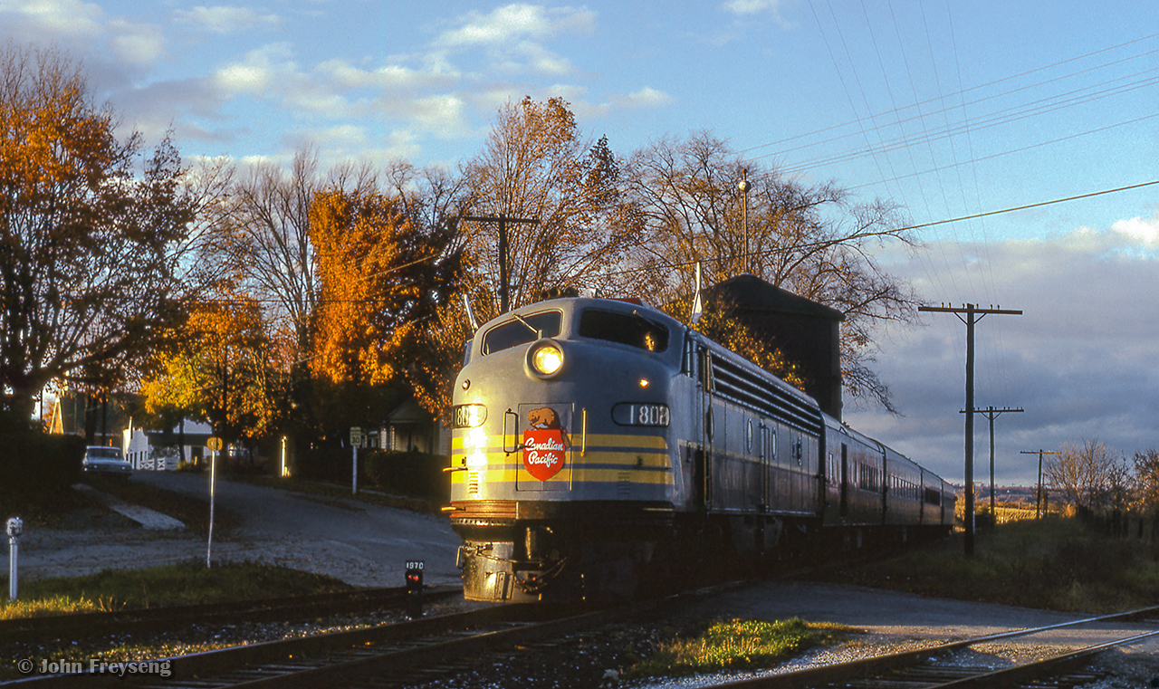 The weekend of October 23 & 24, 1965 saw the Upper Canada Railway Society run an excursion on each of the class one railways. The Saturday trip running on the Canadian Pacific behind CPR E8A 1802 departed Toronto Union station for Hamilton's TH&B Hunter Street station via the Oakville Sub, before heading up to Guelph Junction, Streetsville, and north to Orangeville before returning to Union Station. Here, the train makes a runpast at Inglewood, crossing the diamond with the CNR Beeton Sub.
Scan and editing by Jacob Patterson.