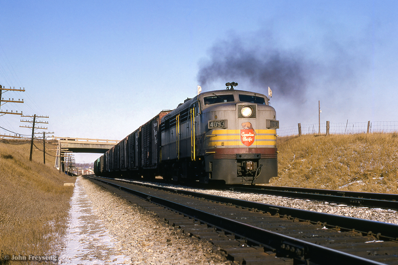 A westbound extra for Mactier passes beneath the 401 along the North Toronto Sub.

Scan and editing by Jacob Patterson.