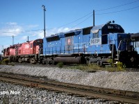 In August 1970, SDP45 3664 was delivered new to the Erie Lackawanna Railroad and eventually became Conrail 6695 following the formation of big blue. Post retirement it became VMV Enterprises (VMVX) 6695, then later Morrison Knudsen Corporation (MKCX) 9515 remaining in its Conrail blue colours. During the 90’s several members of the EL SDP45 fleet were rebuilt into new SD40M-2’s by Morrison Knudsen for Southern Pacific. 9515 seemed to have eluded this rebuilding program and instead became part of the great CP lease fleet of the mid-90’s. Where it went after its lease to CP someone on here might know as the trail seems to have gone cold. However, decades later, Athearn Genesis did do an HO model of it in this same version.
<br>
Here on a September morning, MKCX 9515 along with CP Control Cab 1100 and SD40-2 6043 wait between assignments at CP’s Toronto Yard diesel shop. 
