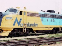 Ontario Northland FP7A 1987 is seen between runs at the coach yard near Toronto Union Station in August of 1983. The Toronto skyline is seen beyond in the summer haze. Lots of details visible for modelers of the old F units.