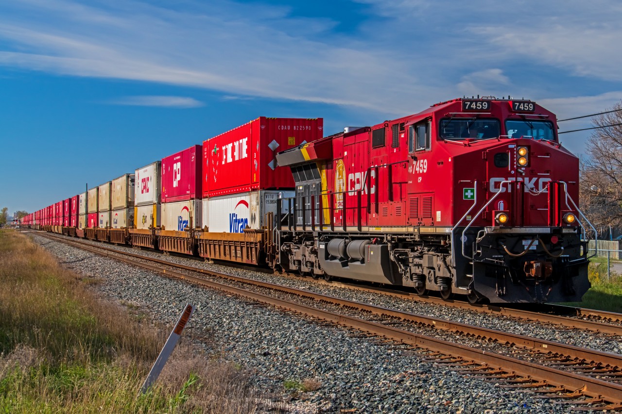 Freshly paint CPKC 7459 leading their intermodel train through North East Winnipeg on the way to Ontario and beyond.