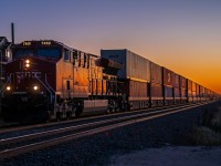 As the sun rises in Eastern Winnipeg. CPKC 7450 leads their intermodel train into town.