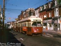 TTC PCC 4651 (ex-Cleveland A11-class, built by Pullman in 1946) heads eastbound on Queen Street West, operating in MU with another A11-class PCC on the busy Queen route approaching Bathurst Street in the morning light. The low-rise Victorian storefronts advertise furniture, appliances, Yukon Variety and Fineberg's Deli. An old Neilson's Dairy delivery truck is in the curb lane unloading.<br><br><i>James L. Alain photo, Dan Dell'Unto collection slide.</i>