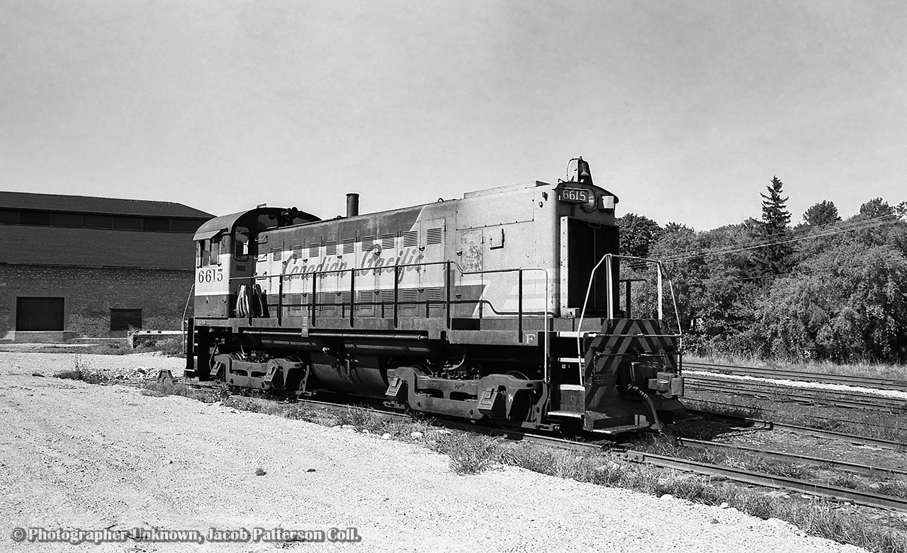 CPR MLW S11 6615 is assigned to the Guelph yard job, seen parked downtown on the former ramp track.

Original Photographer Unknown, Jacob Patterson Collection Negative.