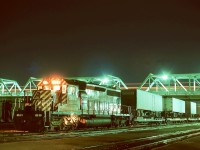 Before CP Lethbridge was relocated west in 1984 to Coalhurst (later Kipp), Lethbridge yard was in downtown, and was overpassed near the depot by a roadway (Stafford Drive, as far as I recall).  In the evening of Tuesday 1974-10-15, westward hotshot connection from Dunmore running as train number 79 with SD40-2 CP 5644,  bound for Union Pacific interchange at Kingsgate, BC, paused for crew change.  Today, the mainline has been relocated 270 metres north, but the depot survives at 801 on 1 Avenue South, with MLW 2-8-0 CP 3651 on display nearby.