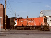 The CP E&N mainline ended at mile 0 at Store and Cormorant Streets in Victoria, but rails continued compass northward on Store Street to serve industrial customers and a freight shed and transloading yard.  A priority customer was Swift Canadian Company’s meat packing plant, frequently the first switch move for the Victoria 0600 yard crew.  On Monday 1979-04-23, their assigned unit was Baldwin DS4-4-1000 CP 7070, shown here spotting a mechanical refrigerator car to Swift’s, engineer Ken Barr.

<p>Note the clear display of the unit number ahead of the cab, compared with the well-worn lettering on the hood side.  An often-applied theory of mine was that an engine deserves its number clearly displayed, done bit by bit on quiet graveyard shifts at the roundhouse.

<p>CP 7070 is notable as the only one of CP’s eleven Baldwin switchers to never serve on Vancouver Island for the first 29 years of their existence since new in 1948.  By some happy coincidence, with most of the switchers out of service, 7070 survived to finally visit the E&N starting in January of 1978, and with 7072 lasted until April 1982.