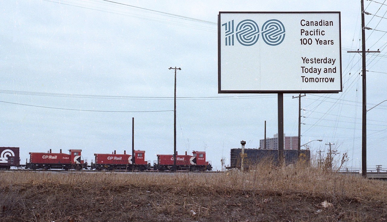 Hard to believe how the time is going by. It has already been almost 45 years since this sign was erected at Agincourt yard announcing 100 Years of the Canadian Pacific.
In the background, moving freight around the yard are diminutive (by today's standards) are GMD SW9 switchers, 7403, 7401 and 7404.