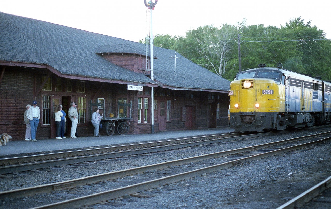 There were still a few people standing around waiting for the Toronto section of The Canadian on this warm June evening.  Don't know what happened, but the early afternoon train did not show up until 2045 hrs. Fortunately for me, it was still light out. Just barely.  Here we see southbound VIA 6791 (and 6634) making the station stop. It was very unusual to see an MLW (FPA-4) along this route. Almost always we were treated to GMDs.