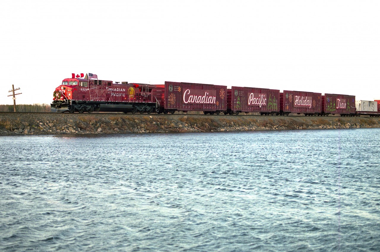 Well, it is almost CP Holiday Train time again. Since I already know I will be too lazy to fight the QEW and Skyway bridge traffic come that day this year, I guess I will cop out by posting an image from 14 years back.
This is CP 9824 leading the train over the causeway at Mountsberg; just before sundown, as it is usually dark by the train sets up in Cambridge.
Not sure if the south side here at Mountsberg is accessible any more. I shot over here to avoid the pole line.
Changes at the park and new fencing might now have this location off limits.