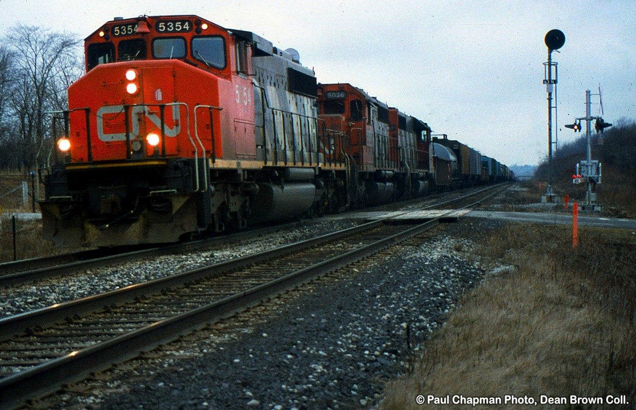 CN SD40-2(w) 5354 leads 333 from Mac Yard to CR Frontier Yard as they climb the grade at mile 6.3 on the CN Grimsby Sub at Garner Rd. 

This train was renumbered to 339 after the CR merger on June 1, 1999