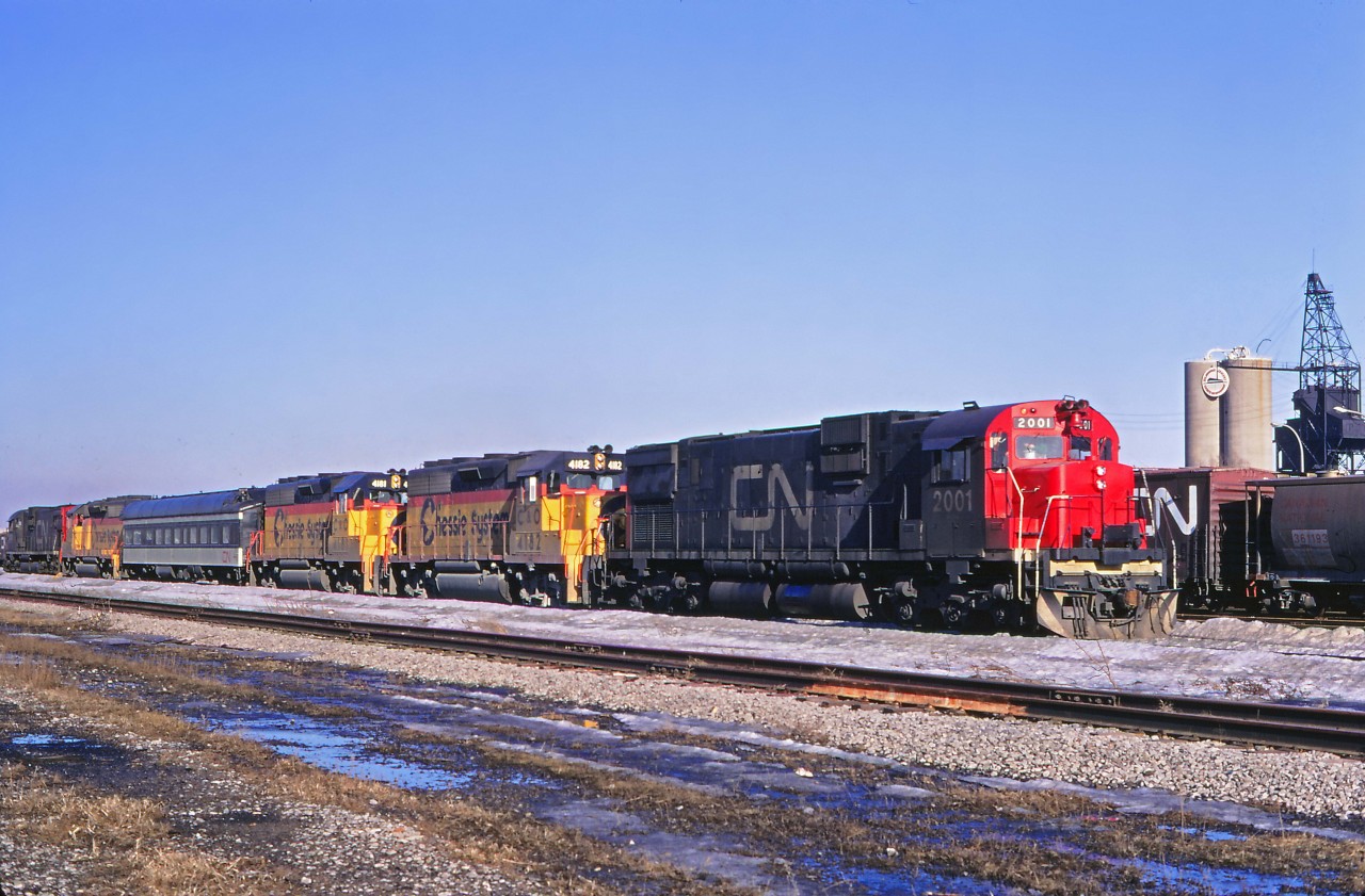 The winter snows are melting as CN managers evaluate a trio of C&O GP40-2s (4182, 4181, and 4184), using C630Ms 2001 (near), 2000 (far), and CN Research car 15015. The tests must have been successful, for CN ordered 268 similar units (delivered between 1974 and 1976) and eventually acquired 10 of GO Transit's 11 units. (Montreal Yard is an "educated guess" for the location; unfortunately I don't have the exact date or location of the photo.) According to the 2025 Canadian Trackside Guide, 59 GP40-2LWs and GP40-2Ws are still on the CN roster.