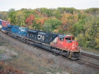 SD70M-2 8828 leads CN owned GECX 2038--still in GE blue even though it has been on the CN roster for almost eight years--through "Ham West" on Z14891 (Chicago Markham Yard-Toronto MacMillan Yard). From what I understand, three other ET44ACs are still running around not repainted.