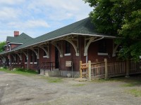 <br>
<br>
Built 1913 by the CNoR, and in 1928 CNR added an east end extension, the station handled the usual freight and passengers as well as customs and immigration functions.
<br>
<br>
Acquiring Heritage Building status circa 1984, the building serves as a family social services centre. 
<br>
<br>

Street side east view, at the former CNoR / CN Fort Francis depot, mile 88.9 Fort Francis Subdivision, June 20, 2025 digital by S.Danko
<br>
<br>
Unfortunately the rail side view is restricted by a sturdy high fence account the busy rail yard. 
<br>
<br>
Noteworthy:
<br>
<br>
 East of the station, Duluth Junction (mile 88.1) is the connection to the rail bridge (Pithers Point built 1908) to Rainier Minn. (east of International Falls, Minn.) and appears to be busy with UP (run through?, witnessed a UP powered unit train westbound approaching Duluth Jct. - no pix!) and CN traffic on the former Wisconsin Central / DW&P (merged into WC 2011 (original 1901 Duluth, Virginia and Rainy River Railway)). 
<br>
<br>
The former CNoR Winnipeg main line consisting of the Sprague (Symington to Rainy River, including 43.4 miles through Minnesota); Fort Francis; Kashabowie Subdivisions is fully CTC and is CN's only remaining connection to Thunder Bay.
<br>
<br>
Just east of the connecting wye (Duluth Jct) to Rainier Minn., the CNoR built lift bridge (aka Five Mile Bridge / Rainy River Lift Bridge built circa 1909) over the Rainy River, collapsed August 14, 2024 while the lift portion was being raised. The collapse severed CN access to Thunder Bay until mid September 2024 when temporary repairs were completed. A new bridge is planned and awaiting Transport Canada approval.
<br>
<br>
At bottom left note the shadow of a telegraph / hydro pole. 
<br>
<br>
sdfourty 
