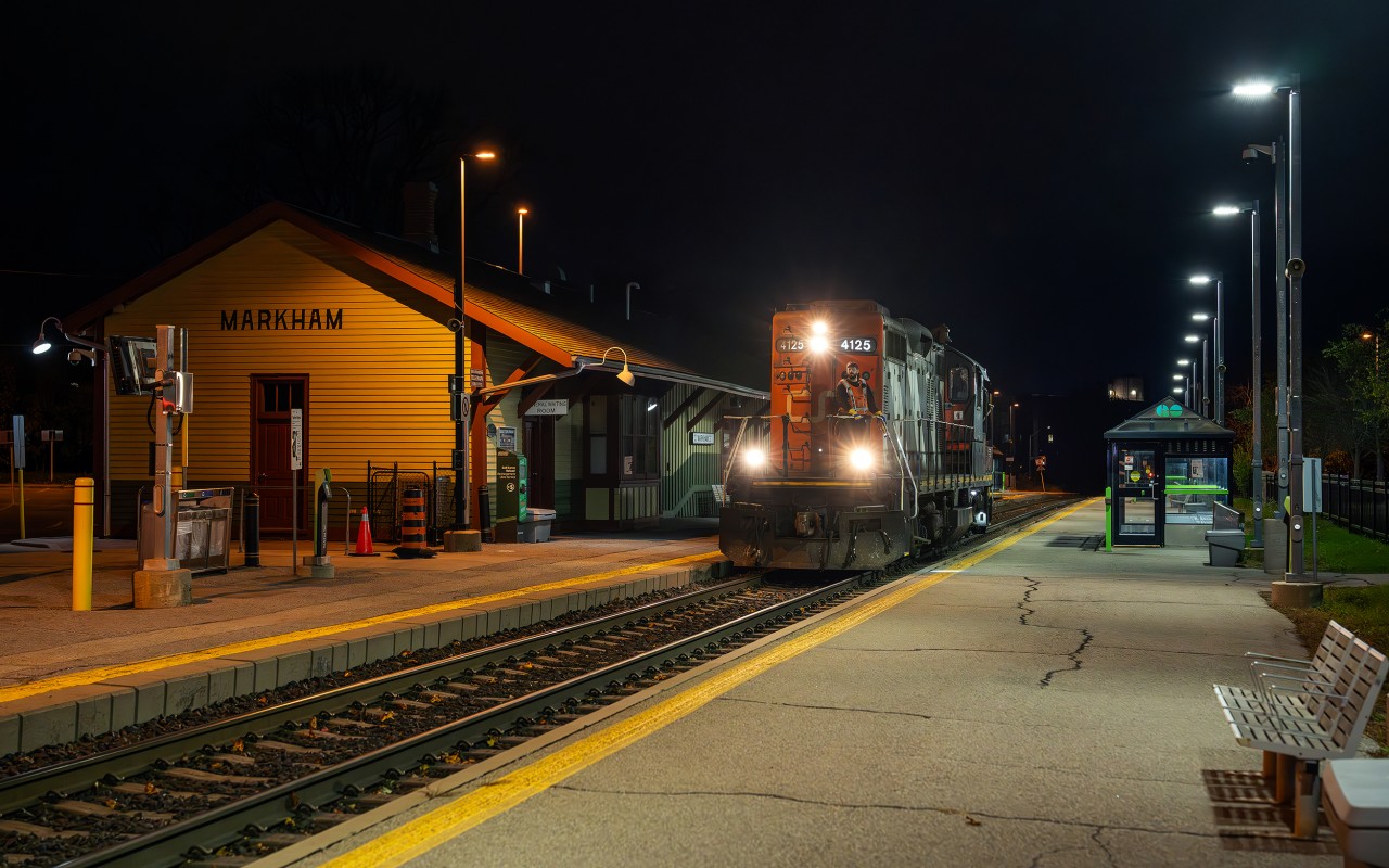 On the evening of November 5th, CN ran a second section of L546 up the Uxbridge Subdivision to retrieve two heritage rail cars from Lincolnville, ON for delivery to MacMillan Yard via the Uxbridge, Kingston, and York Subdivisions. Due to not having an SBU available, the movement was restricted to 15 miles per hour for the whole trip, limiting the crew's ability to make Mac Yard, thus the train was yarded in Oshawa at daybreak. CN L54632 05 consisted of CN GP9 4125, ex-ONT coach RPDX 2514, and an ex-VIA/nee-CN baggage RPDX 9636...the Rapido reporting marks tip us off as to the equipment's destination, which I can only guess will be Salford on the Ontario Southland, who will do the job of repainting both cars at the behest of the VIA Historical Association.

In this scene, lone Geep 4125 tiptoes past the platforms at Markham GO station, headed northwest towards Lincolnville layover facility where the two cars are parked awaiting a lift.