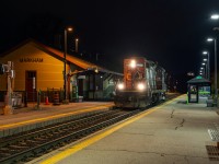 On the evening of November 5th, CN ran a second section of L546 up the Uxbridge Subdivision to retrieve two heritage rail cars from Lincolnville, ON for delivery to MacMillan Yard via the Uxbridge, Kingston, and York Subdivisions. Due to not having an SBU available, the movement was restricted to 15 miles per hour for the whole trip, limiting the crew's ability to make Mac Yard, thus the train was yarded in Oshawa at daybreak. CN L54632 04 consisted of CN GP9 4125, ex-ONT coach RPDX 2514, and an ex-VIA/nee-CN baggage RPDX 9636...the Rapido reporting marks tip us off as to the equipment's destination, which I can only guess will be Salford on the Ontario Southland, who will do the job of repainting both cars at the behest of the VIA Historical Association.In this scene, lone Geep 4125 tiptoes past the platforms at Markham GO station, headed northwest towards Lincolnville layover facility where the two cars are parked awaiting a lift.