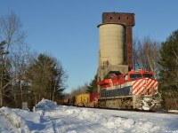 CN X100 - CN 3115 South passes the coal chute at Washago South sporting its sharp looking BC Rail "Hockey Stick" colors on a beautiful December afternoon. 