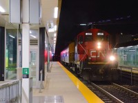 In the early morning hours of November 5, a second section of CN L546 made a trip east along the Uxbridge Sub to Lincolnville, where two cars from the defunct York Durham Heritage Railway were waiting to depart for their new owner; the VIA Historical Society.<br><br>Limited to 15mph due to not having an SBU, the movement consisting of RPDX 2514, a 1954 Snack Car of ONR/VIA/CNR heritage, and RPDX 9636, a 1954 baggage car of VIA/CNR heritage, is seen passing Unionville GO station.  On arrival at Scarborough, the cars will be runaround and taken to Oshawa.  Eventually these cars will be sent to OSR shops at Salford for painting.