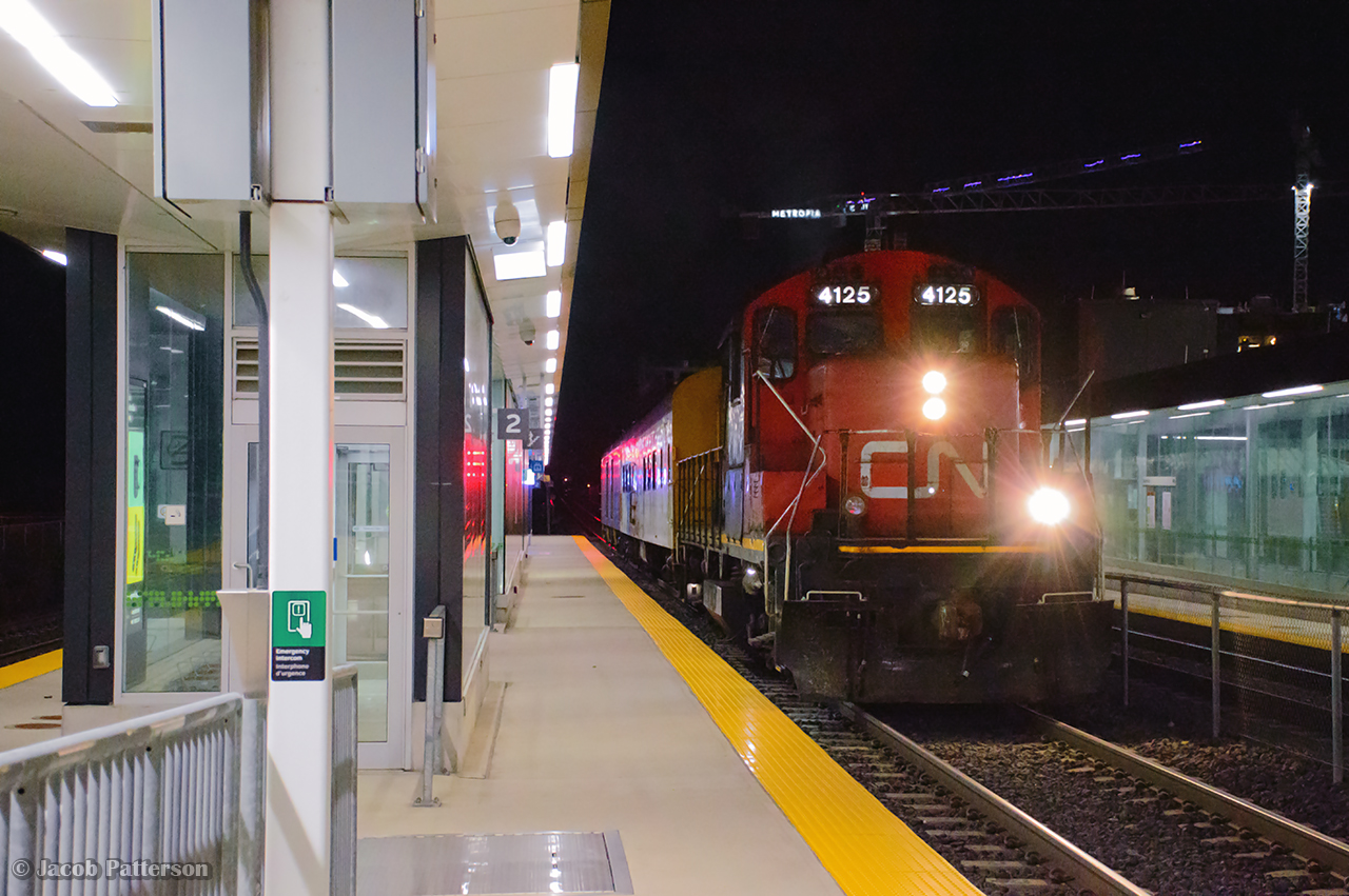 In the early morning hours of November 5, CN L546 made a trip east along the Uxbridge Sub to Lincolnville, where two cars from the defunct York Durham Heritage Railway were waiting to depart for their new owner; the VIA Historical Society.

Limited to 15mph due to not having an SBU, the movement consisting of RPDX 2514, a 1954 Snack Car of ONR/VIA/CNR heritage, and RPDX 9636, a 1954 baggage car of VIA/CNR heritage, is seen passing Unionville GO station.  On arrival at Scarborough, the cars will be runaround and taken to Oshawa.  Eventually these cars will be sent to OSR shops at Salford for painting.