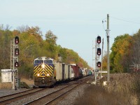 CN 369 with an ex-CREX unit up front is about to pass the long closed Morrisburg Station.