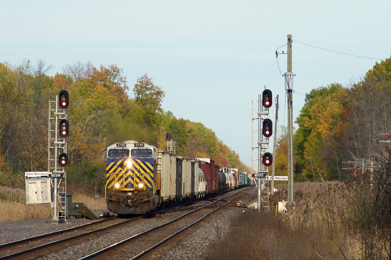 CN 369 with an ex-CREX unit up front is about to pass the long closed Morrisburg Station.