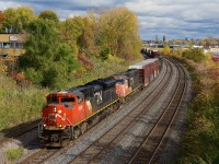 CN 8888 leads CN 527, on its way to Taschereau Yard.