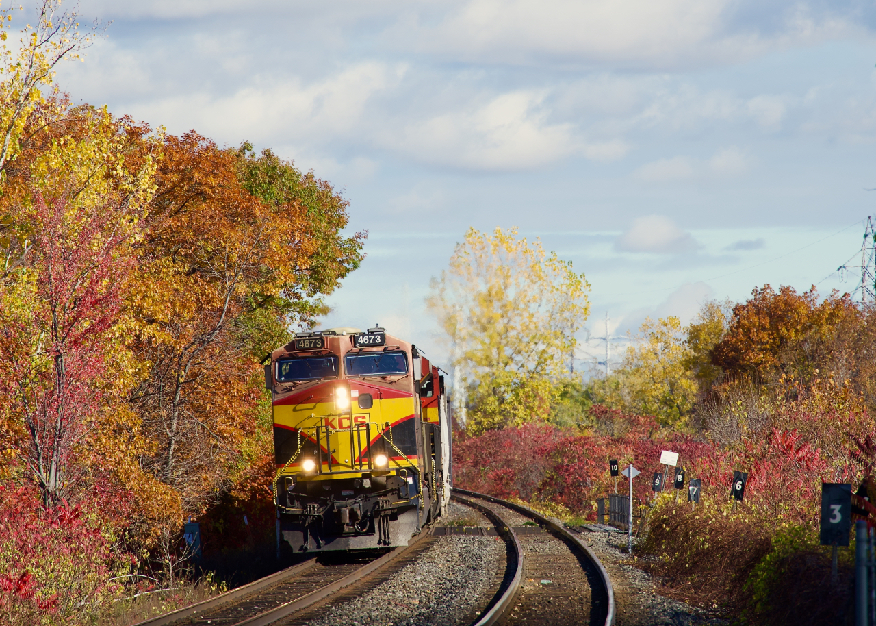 CPKC 9231 approaches the Île-Perrot Station with KCSM 4673 leading.