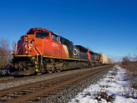 A slightly late CN 271 is approaching CN Caron with an SD70M-2 and a Dash9-44CW for power.