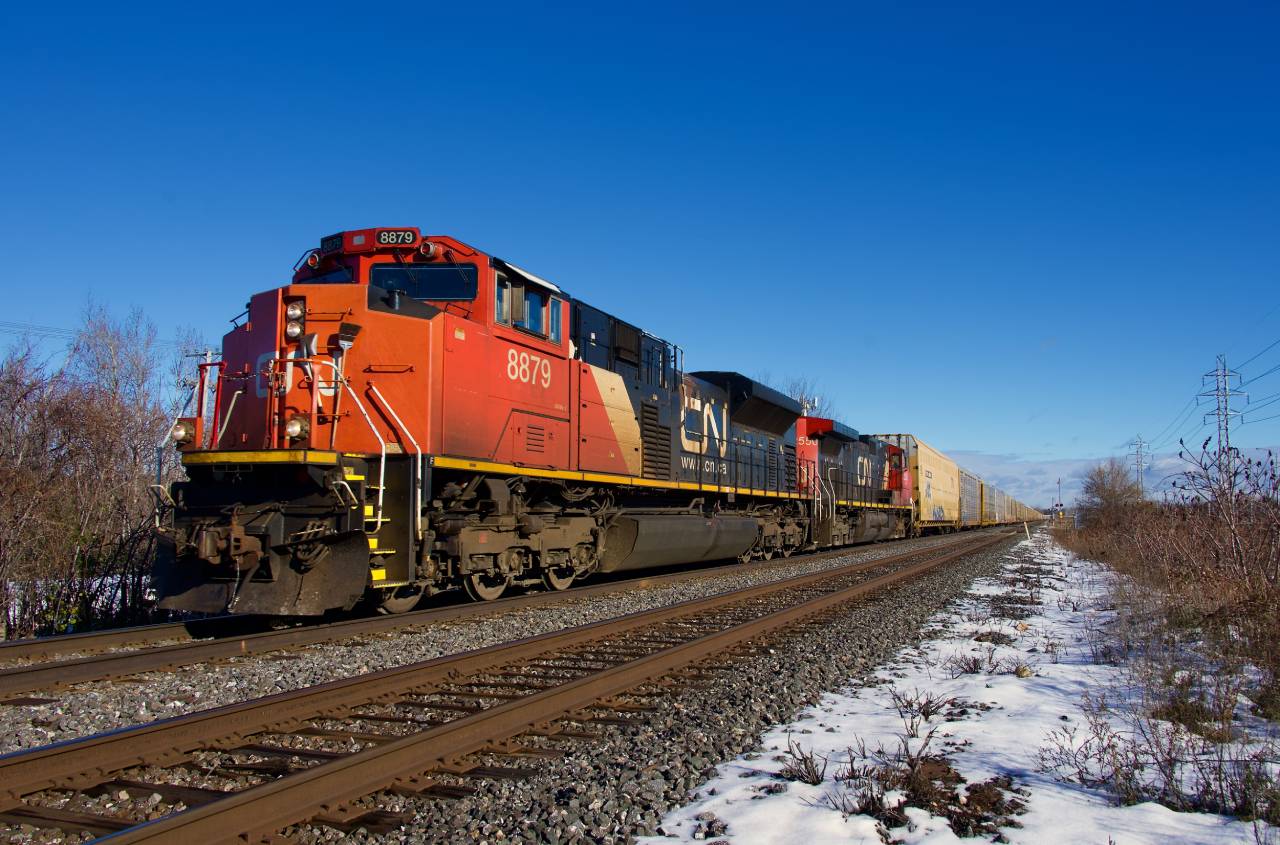 A slightly late CN 271 is approaching CN Caron with an SD70M-2 and a Dash9-44CW for power.