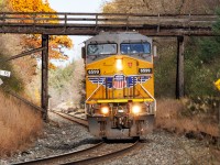 A tale of 734. 734 is a Chicago to Ontario train that is completely random. It is almost always entirely empty autoracks that it peddles across Southern Ontario, sometimes filling sidings, sometimes the yards at Pender and Wolverton, and who knows where else. It can also sit for days when there's no place to put them. Sometimes it terminates at Wolverton, or London, sometimes it becomes power for 137, or is used for numerous other jobs. As often as not, it uses foreign power. 

Today, it worked its usual magic, setting off the last of its cars at Wolverton. Likely to fill a need for tomorrow, it was going to run light power to Toronto. Then Murphy got involved. Toronto -Welland 236 was heavy.....really heavy, and stalled on the Niagara Escarpment west of Milton. But an hour after stalling, 734's power showed up.....and became the pusher, eventually shoving 236 to Campbellville, where it would begin its long descent into Hamilton. 

In the 2.5 hours it took to get that done, someone decided the ower should go west...and go west it did, approaching Cambridge on a wonderful fall afternoon....but looking very lonely....kind of like Thomas on a bad day. 