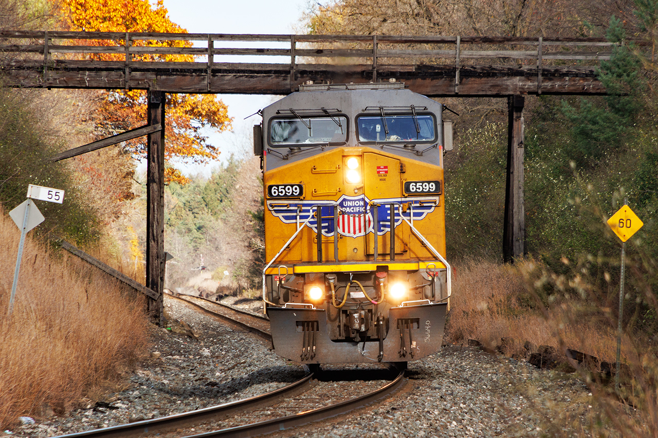 A tale of 734. 734 is a Chicago to Ontario train that is completely random. It is almost always entirely empty autoracks that it peddles across Southern Ontario, sometimes filling sidings, sometimes the yards at Pender and Wolverton, and who knows where else. It can also sit for days when there's no place to put them. Sometimes it terminates at Wolverton, or London, sometimes it becomes power for 137, or is used for numerous other jobs. As often as not, it uses foreign power. 

Today, it worked its usual magic, setting off the last of its cars at Wolverton. Likely to fill a need for tomorrow, it was going to run light power to Toronto. Then Murphy got involved. Toronto -Welland 236 was heavy.....really heavy, and stalled on the Niagara Escarpment west of Milton. But an hour after stalling, 734's power showed up.....and became the pusher, eventually shoving 236 to Campbellville, where it would begin its long descent into Hamilton. 

In the 2.5 hours it took to get that done, someone decided the ower should go west...and go west it did, approaching Cambridge on a wonderful fall afternoon....but looking very lonely....kind of like Thomas on a bad day.
