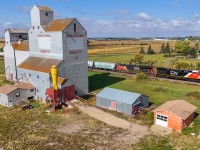 Relatively “new” rebuild CN 3417 cruises past the elevator at Asquith with Edmonton to Melville train G 84251 15. 