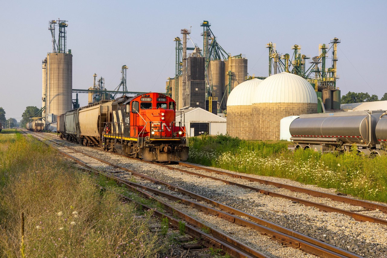 History Awaits, Created By You!

CN L514 departs the small town of Blenheim Ontario, with CN 4116 taking the lead. This is only just a small snapshot of what used to be here compared to this spot back in the pre 1990s. Crazy enough that this line used to be busy enough with C&O Traffic to justify CTC, in which evidence of signal masts still scattered around the old Blenheim junction just a mile behind me. Purely fascinating, if only I had a time machine.... But you take what you have, and over the years I have learned to not take everything for granted, even if most people cant see it yet. This is one of the very few railway lines that I actually feel could get abandoned in my lifetime. 


So, this summer, I took the time in, with many attempts over the years, to see 514 leading northbound with cars in some nice afternoon sunlight. Not that hard right? :) Well, this particular job is very unpredictable, in which the crew can be called at any time, usually depending on when 439 arrives into Windsor, but can still vary throughout the day. But fine, lets say they get ordered in the afternoon, then add on the uncertainty of them bringing cars OUT of Blenheim, or even running down here at all. Not to even mention the amount of times I have had a cloud wall come out of nowhere right as they were departing the town or the sun setting too soon. Anyways, enough complaining, as that's not what I am here to do. The main point of the speech is to always document document document! As you never know this could be the last time you experience it!