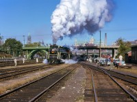 During a stop over in Ottawa after the overnight Toronto - Ottawa leg of the <a href=https://www.railpictures.ca/?attachment_id=55181>massive 692.2 mile trip behind CNR 6167,</a> the morning <a href=https://www.railpictures.ca/?attachment_id=55753>CPR movements are out of the way,</a> and 6167 can prepare to take the 17 car train <a href=https://www.railpictures.ca/?attachment_id=54757>across northern Ontario</a>.  Switching movements commence beneath the Laurier Avenue Bridge with the Parliament Buildings towering over the scene at left, and the Chateau Laurier at centre.

<br><br><i>Scan and editing by Jacob Patterson.</i>