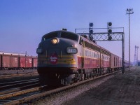 Montreal - Havelock - Toronto pool train 21 pauses at Leaside before heading down the Belleville Sub Don Branch to Union Station.  Less than a year remained at this time for the pool train agreement which would come to an end at midnight on October 30, 1965. CPR overnight pool trains 33 & 34 became CPR daytime RDC runs Toronto - Peterborough - Havelock - Smiths Falls - Bedell Jct. - Ottawa. The CPR overnight pool trains 21 & 22 became luxury late afternoon trains Toronto - Belleville - Smiths Falls - Montreal using equipment from CPR's Canadian, including dining car and dome-observation lounge Park cars in a vain attempt to compete with CN’s afternoon Rapido’s to/from Montreal. By January 1966, it had become obvious that CP couldn’t effectively compete with the Rapido’s, so CP applied and was granted permission to terminate trains 21 & 22.

<br><br><i>Scan and editing by Jacob Patterson.</i>