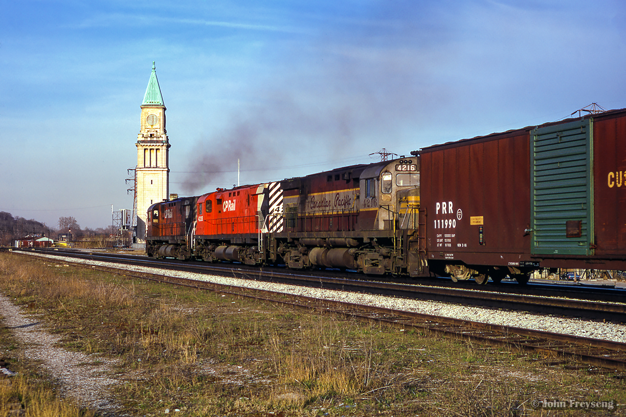 A spring evening finds three C424s eastbound along the North Toronto Sub, passing the old north Toronto station at Yonge Street.

Approaching the scene

Scan and editing by Jacob Patterson.
