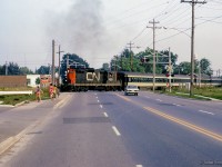 Commuter train 990 for Stouffville departs Markham nearing the end of this evening's run.

<br><br>More Markham:
<br><a href=https://www.railpictures.ca/?attachment_id=55102>CN 632 in 1978</a>
<br><a href=https://www.railpictures.ca/?attachment_id=55096>CN 546 move 2024</a>
<br><a href=https://www.railpictures.ca/?attachment_id=57796>CN 546 move 2025</a>

<br><br><i>Scan and editing by Jacob Patterson.</i>