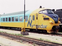 The Northlander trainset is seen here in the Toronto Union Station coach yard in this August of 1983 view, alongside one of the ubiquitous CN MLW S13 switchers that constantly roamed the area. The European designed Northlander was indeed colorful.